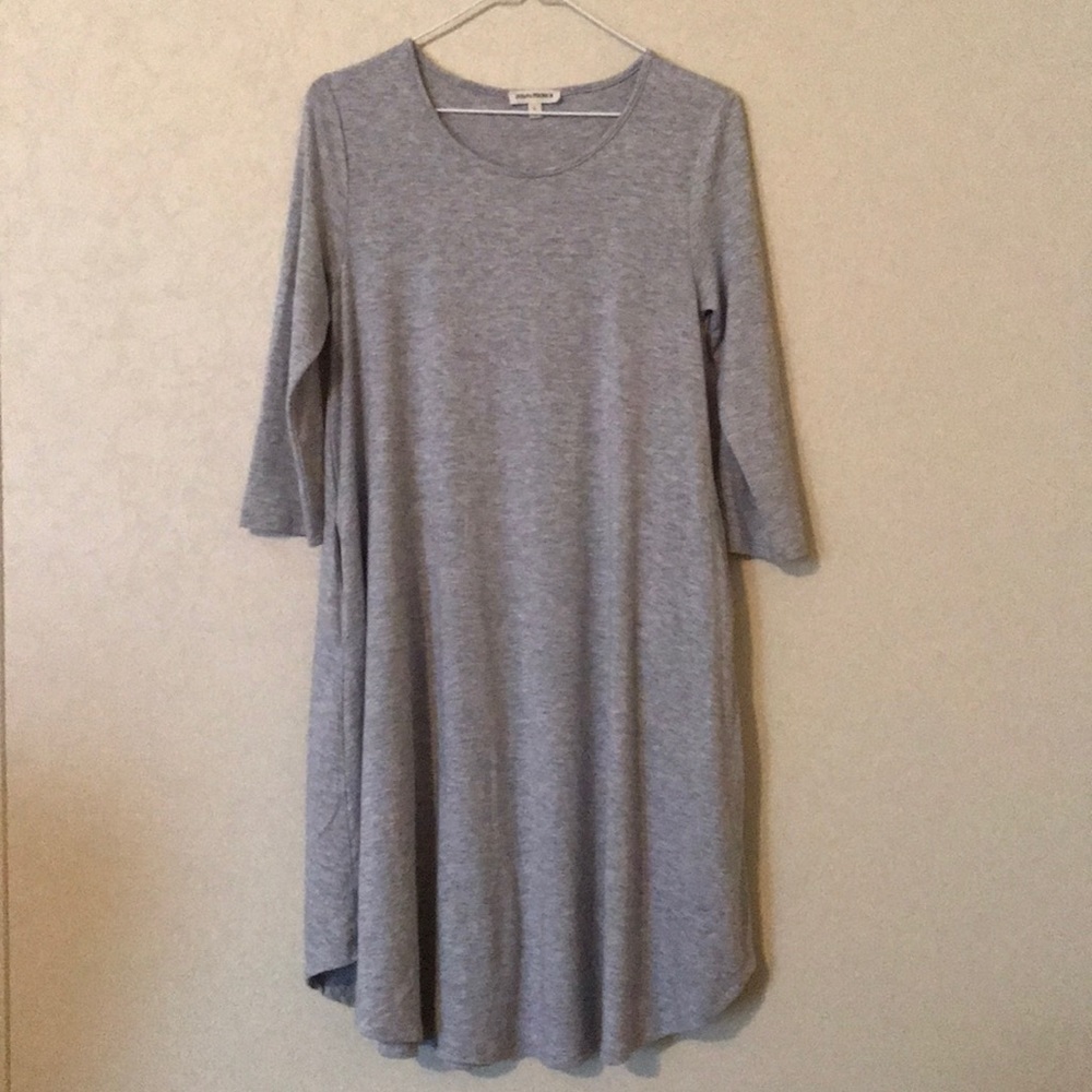 Three quarter sleeve tunic dress with pockets.